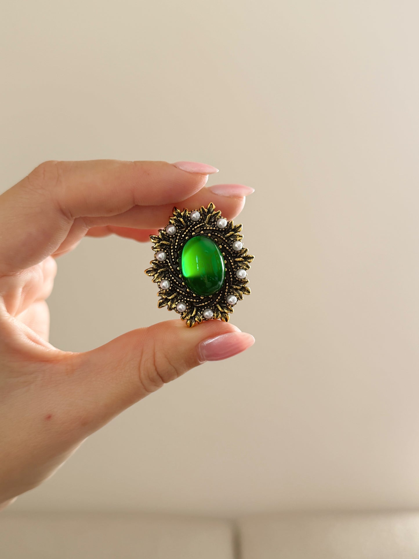 Green stone brooch