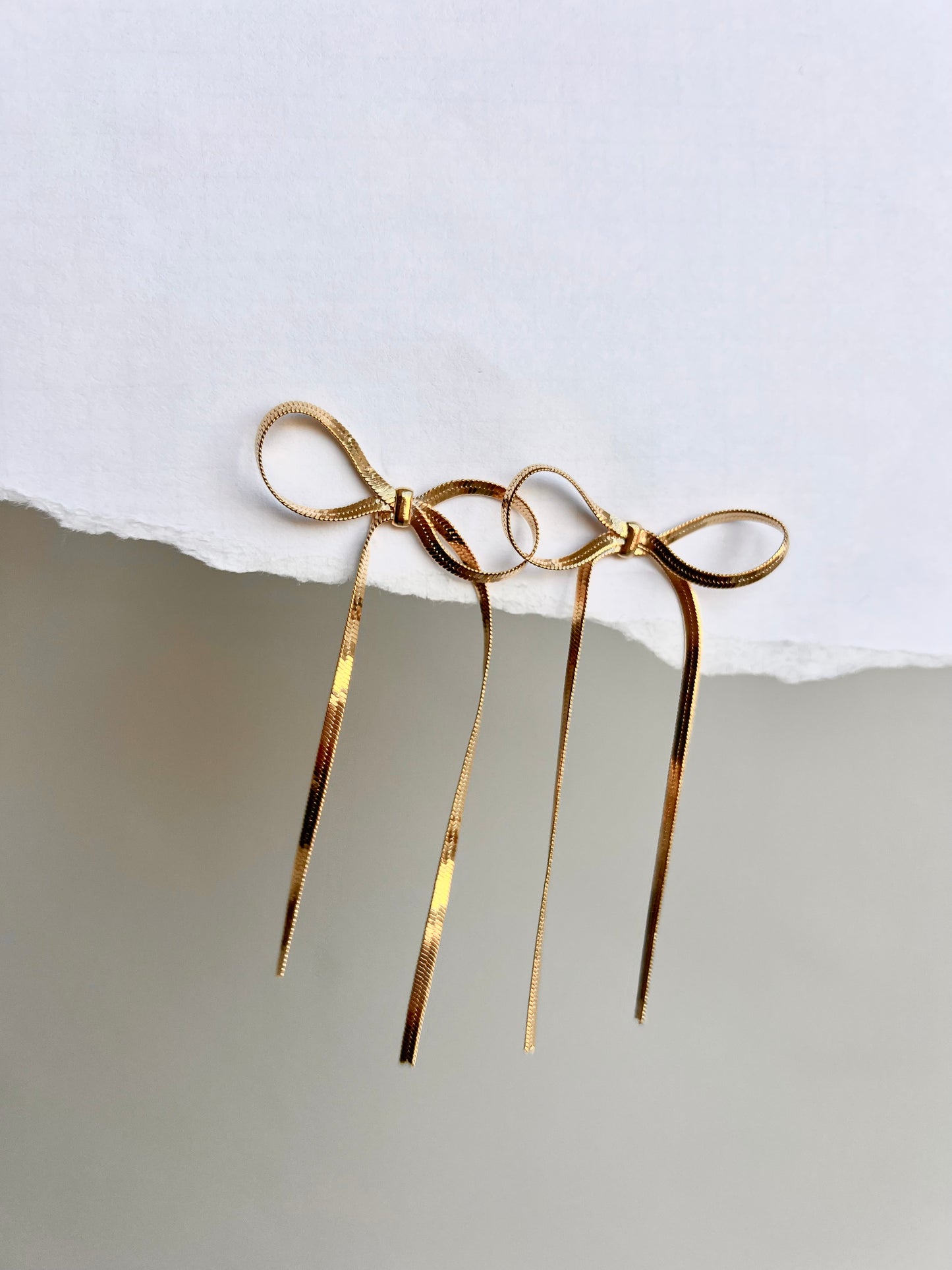 Snake bow earrings