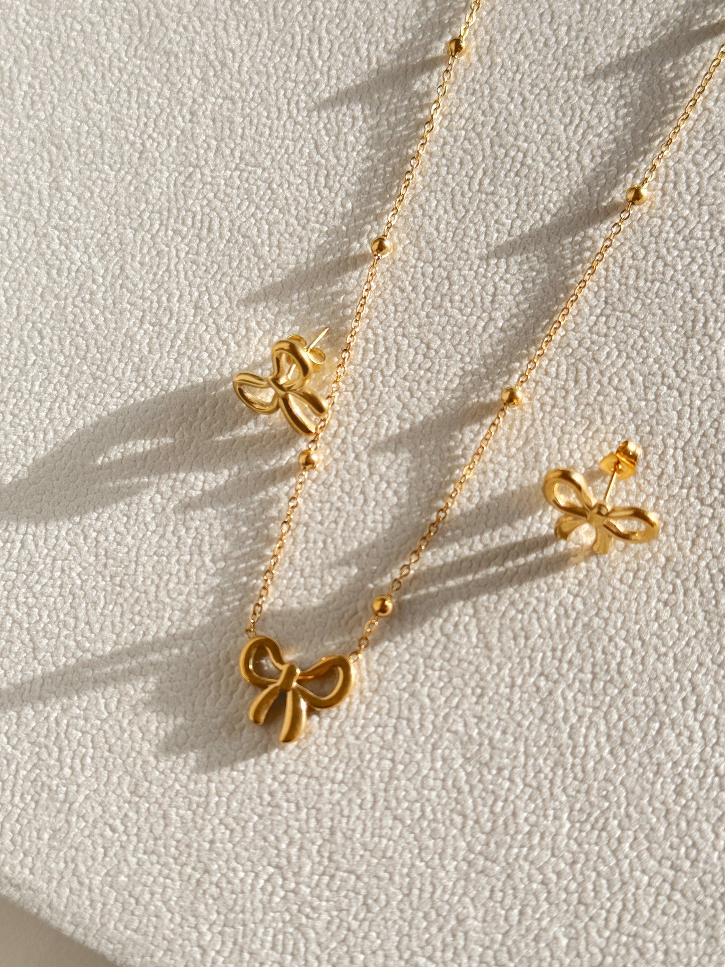 Bow necklace and earrings