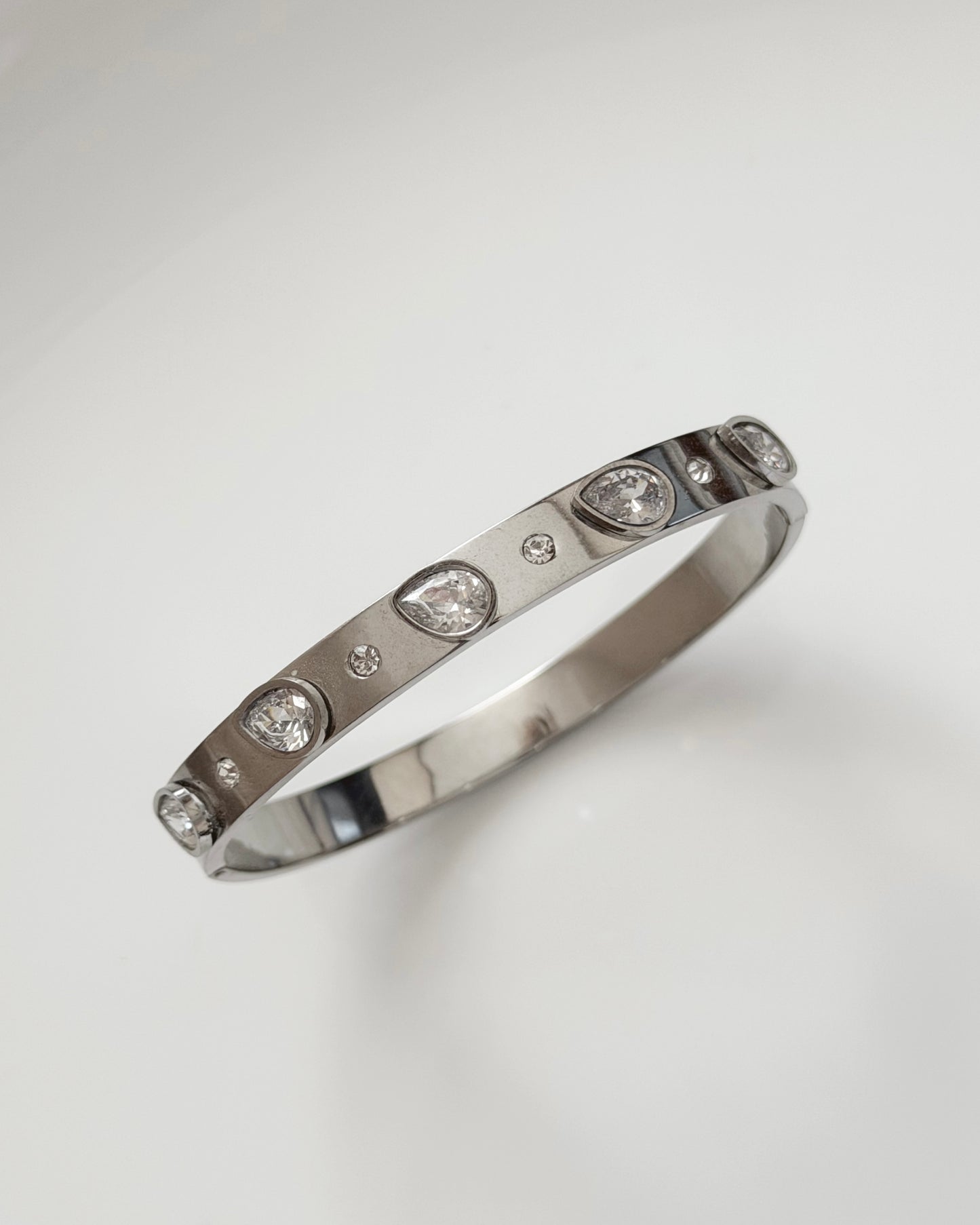 Silver tear drop stone static bracelet