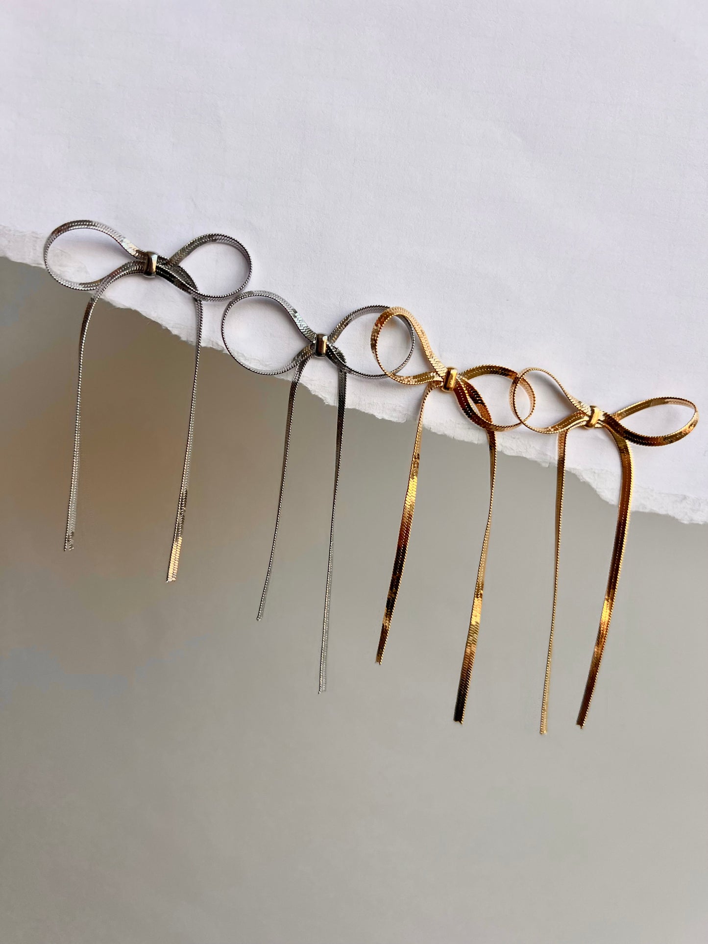 Snake bow earrings