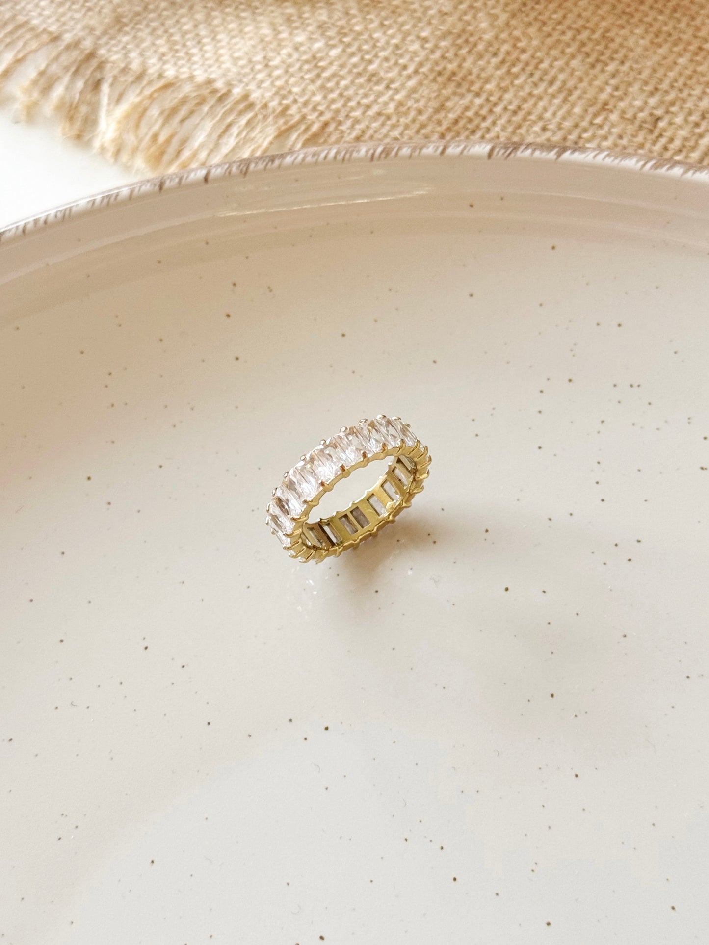 Gold and white tennis ring