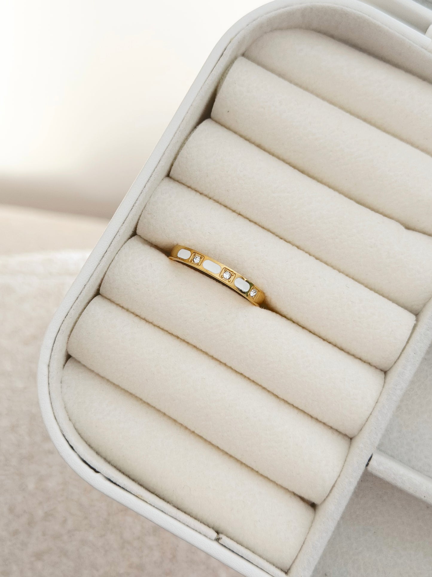 Stones and white ring