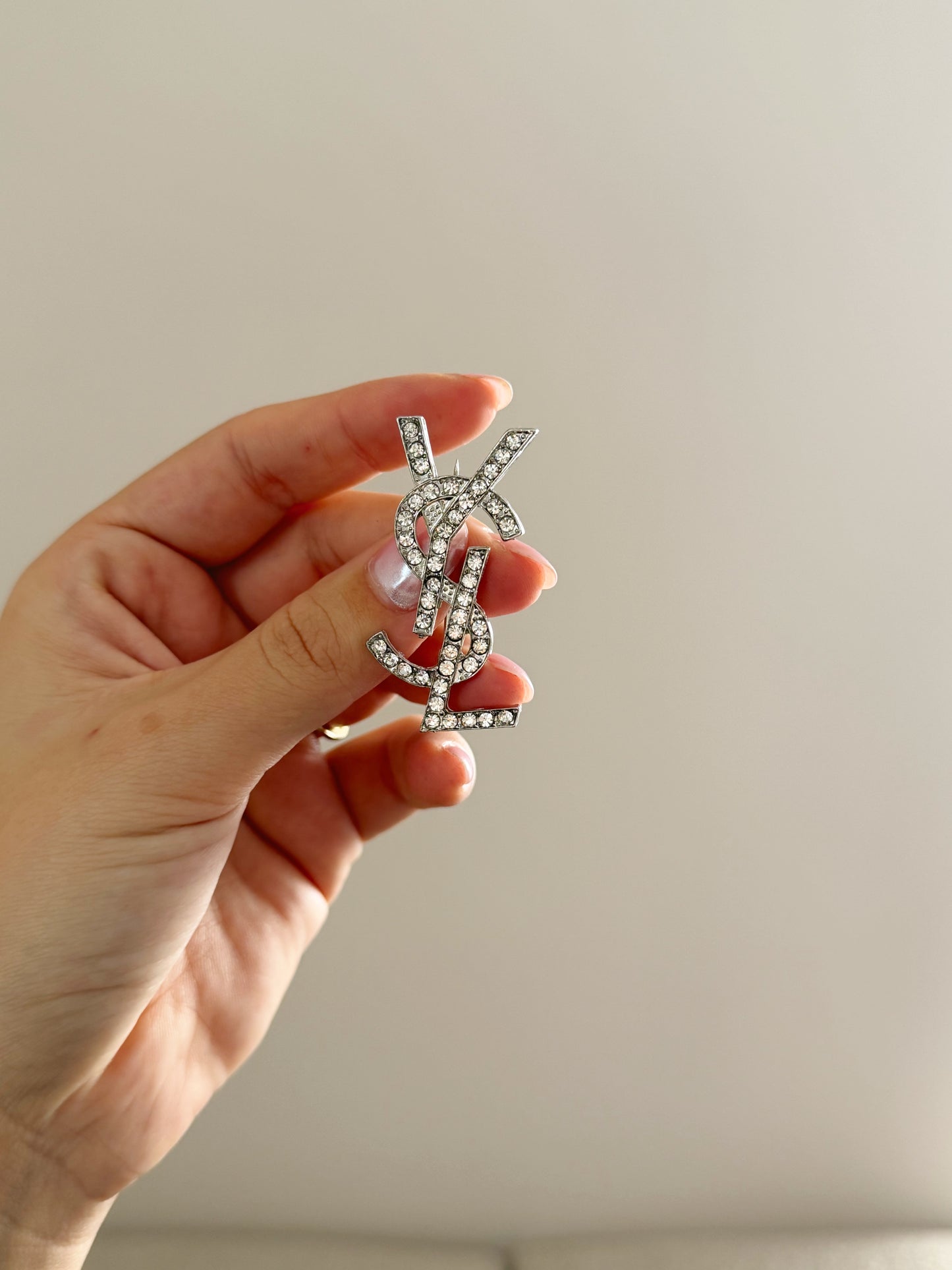 Silver YSL brooch