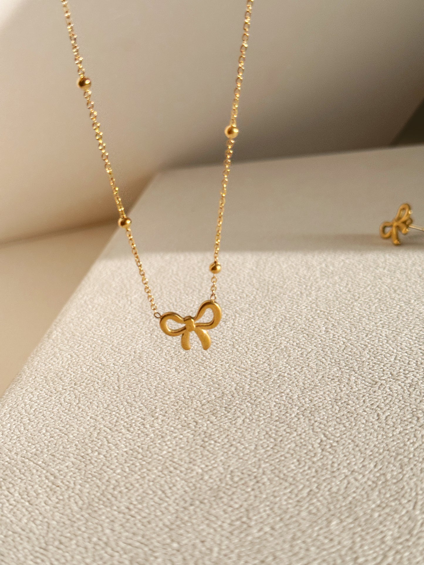 Bow necklace and earrings