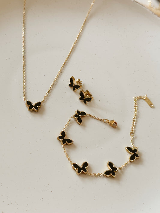 Gold and black van cleef butterfly set