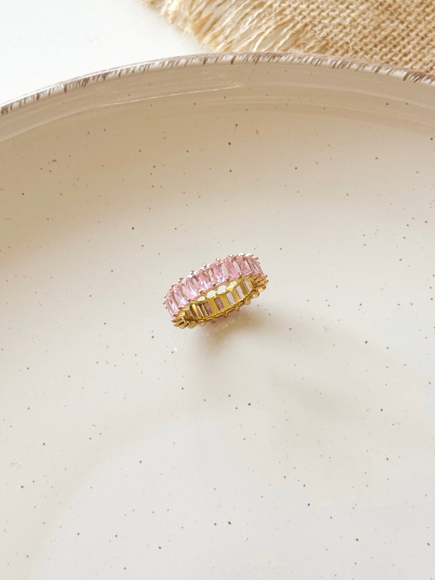 Gold and pink tennis ring