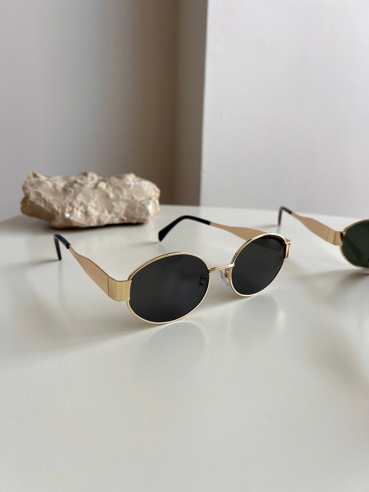 Golden oval sunglasses
