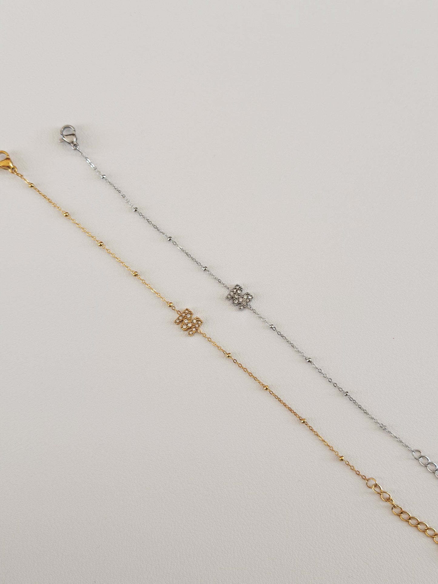 Initial M bracelets gold and silver